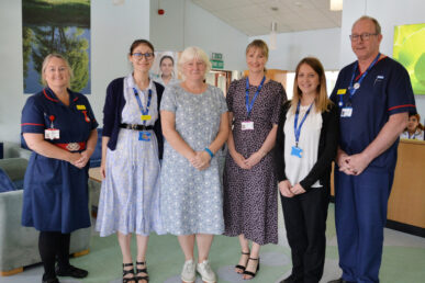 Six colleagues from our private patient units stood in a line smiling in their uniforms.