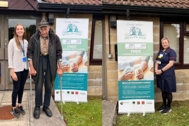 Three people stood outside the Frome Farmers' market health room.