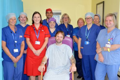 Ileostomy team stood around the first patient to receive operation discharged home on first day