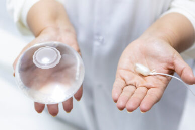 A photo of a two hands holding medical equipment involved in the Allurion procedure.