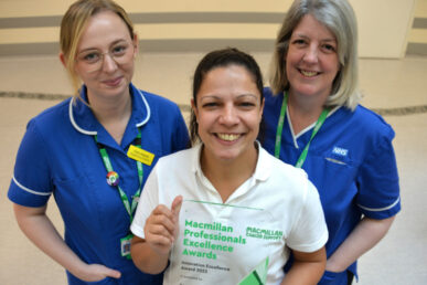 Three people from the Somerset radiotherapy late effects service holding an award.