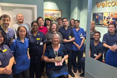 A photo of associate director of international recruitment Trish Spruce with a group of colleagues who joined the trust from overseas.