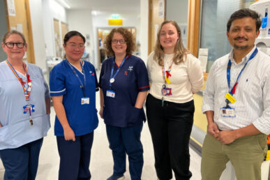 Five colleagues standing in the corridor of the acute medical unit at Musgrove Park Hospital.