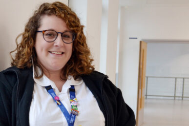 Speech and language therapist Sophie Woodford stood in a hospital corridor.